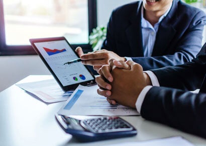 Two men discussing the work graph