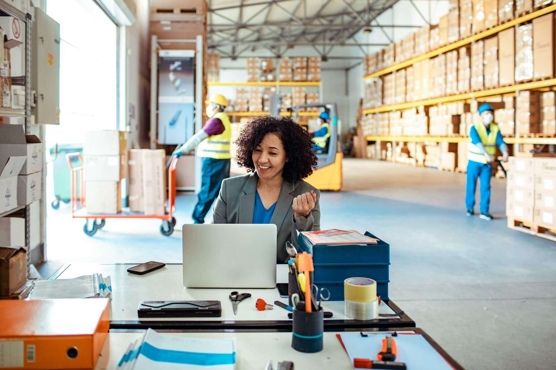 A Women is in the call with client in the factory