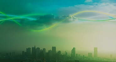 Buildings and clouds with rainbow lanes.