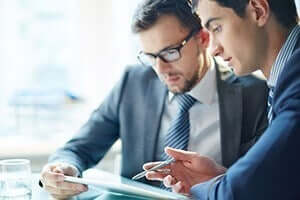 two business dressed men talking