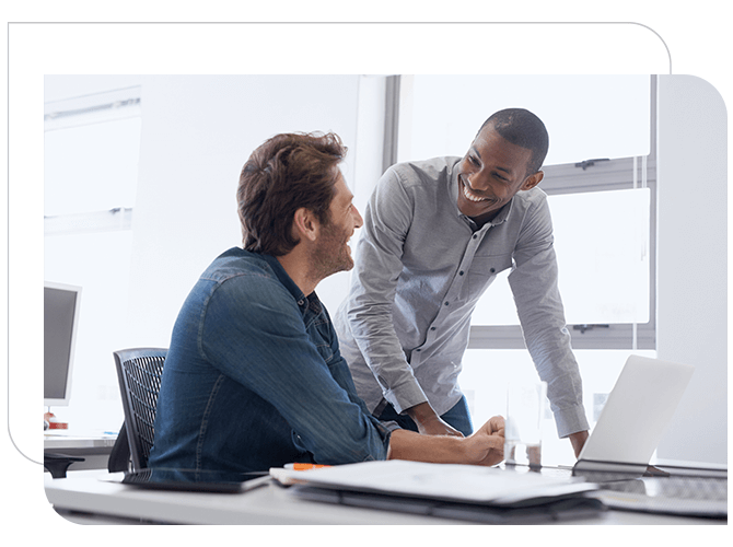 Two employees talking to each other in an office