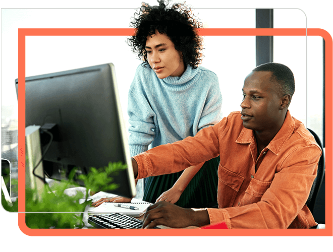 A man showing the details in the computer to women at office.