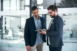 two business men standing up in a discussion