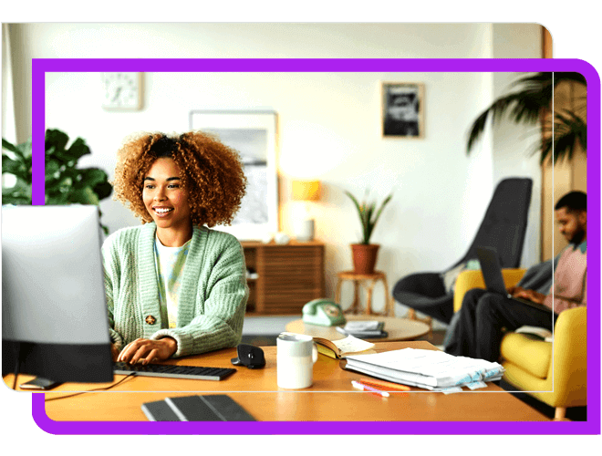 Young woman, green sweater working at home and man on couch working